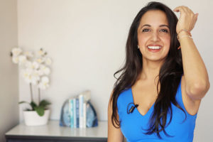 Paula Pant wearing blue clothes posing for Afford Anything photoshoot